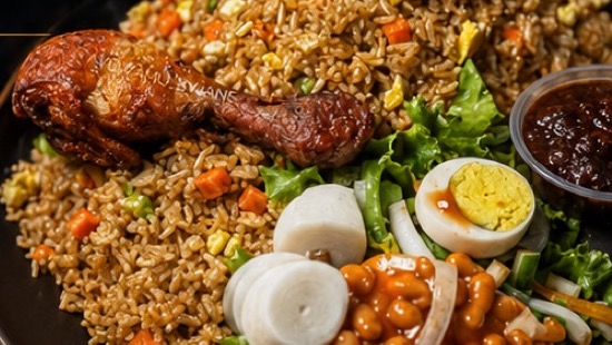 ChopYard seasoned rice platter with grilled chicken, egg, vegetables, and sauce